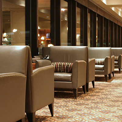 Waiting couches for priority pass members in an airport lounge
